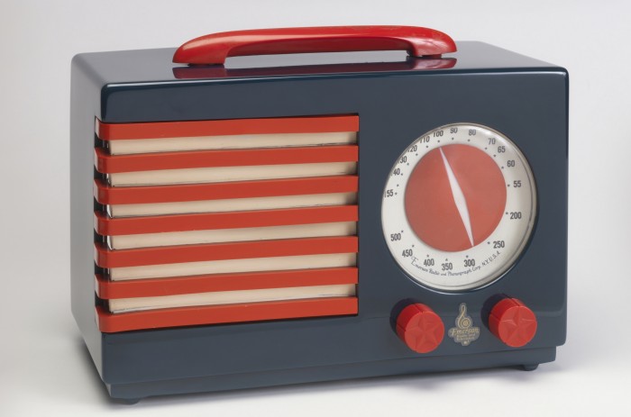 Patriot Radio 1940 Designed by Norman Bel Geddes (American, 18931958) Manufactured by Emerson Radio and Phonograph Corp. (New York, New York, USA) Cast phenolic plastic (Catalin), molded urea plastic, molded cellulose acetate, embossed acetate, metal H x W x D: 20.3 x 27.9 x 14 cm (8 in. x 11 in. x 5 1/2 in.) Gift of George R. Kravis II, 2014 10 1 Photo: Matt Flynn © Smithsonian Institution