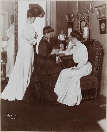 three women, two are seated