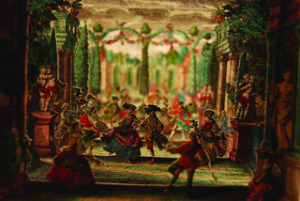 Image features Plates of Garden Scene with Dancers peep-show lined up like a miniature theatre.