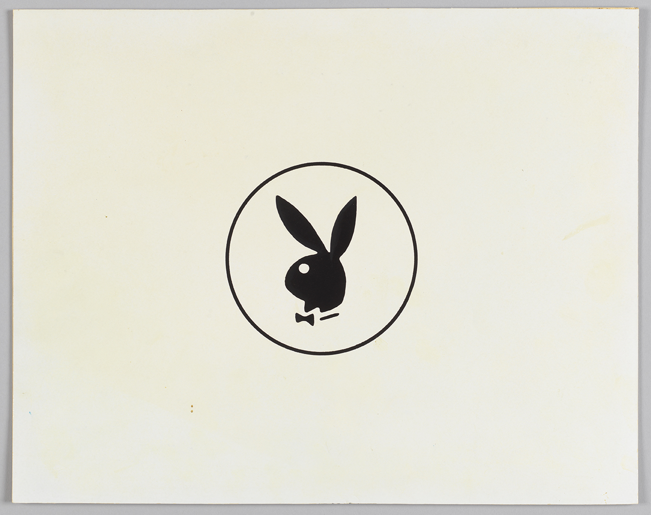 A landscape sheet of paper with the bow-tied Playboy bunny circled and in black at the center.