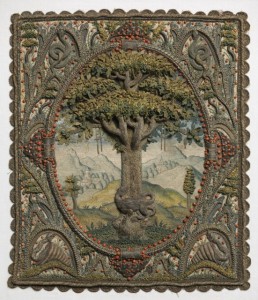 Small panel of embroidery in high relief of a tree in an oval with an elaborate framework. The field is filled by an oak tree with leaves worked in detatched needle lace stitches in shades of green. The trunk and branches are very dimensional, and are worked in silver metallic thread, now tarnished. At the base of the tree is a salamander, also in silver metallic thread. The background shows a landscape worked in pale silks with mountains and buildings, possibly a monastery. From the limbs of the tree hang crutches, a wax leg, and a censer.