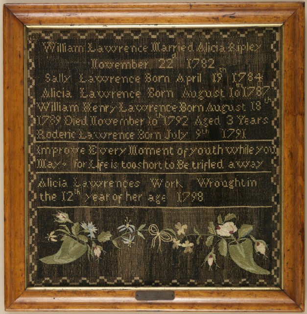 A record of the family of William Lawrence and Alice Ripley. The entire ground is covered in black cross-stitch, with the family dates worked in colored silks, followed by a verse and inscription, and at the bottom two cornucopias of flowers.