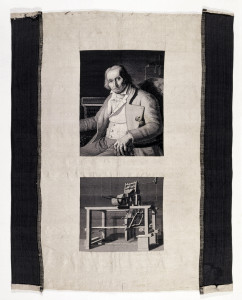 Small piece of white fabric with two woven pictures in shades of black, white and grays. On top, a portrait of Joseph-Marie Jacquard (1752-1834) after a portrait by Jean-Claude Bonnefond (1796-1860). Below, a picture of a loom with the Jacquard punch-card mechanism. Woven on a loom equipped with a Jacquard mechanism by Carquillat (died 1884).