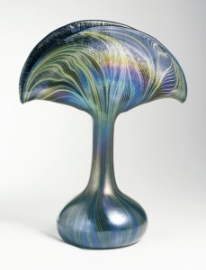 Fan-shaped top tapering into bulbous base. Green and blue striated swirl decoration loosely following shape of vase, ground pontil.