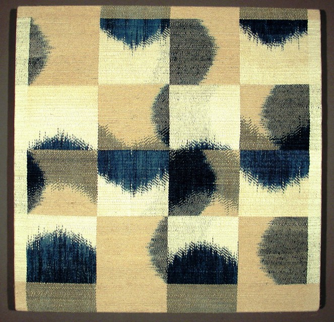 Various blocks of ikat in indigo blue, tan and off-white.