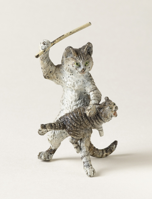 figurine of cat and kitten in cat in the act of spanking the kitten