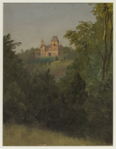Vertical view of a large, two towered house with balconies and a porch, situated on the overlook of a hill, viewed from a distance with trees and foliage in foreground. Two birch trees at right.