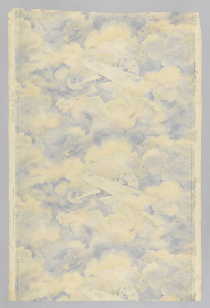 Vertical rectangle, a full width, repeating vertically, showing two and one half repeats. Airplane, the "Spirit of St. Louis", with name lettered on fuselage, against a background of cloud shapes on which the plane's shadow is cast. Printed in blue, red and light yellow. Children's paper.