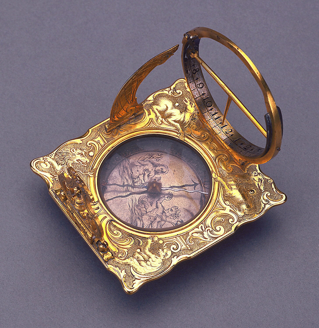 Scrolled square frame with animal allegories of the Four Continents: camel, horse, lion and monkey; hinged quadrant, hour circle with gnomon and pendulum; in center, recessed circular box with compass needle, the face engraved with mermaid and triton; set on three adjustable legs.