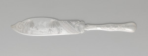 silver cake knife with exotic landscape details
