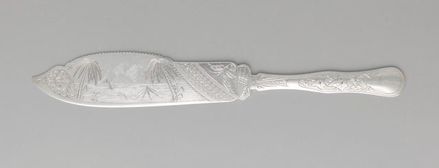 silver cake knife with exotic landscape details