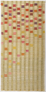 Curtain panel woven in off-white silk with gold metallic wefts which form open vertical stripes. With brocaded squares of yellow, pink, orange and purple densely applied at the top and more sparsely in the lower two-thirds.