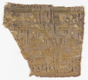 Textile fragment depicting fantastic birds flying up and down into large blossoms.