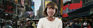Janette Sadik Kahn sits at table in times square