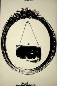 Within an oval frame with floral garnish at top, image of a handbag containing the image of an eye, suspended from a hook. Printed in black on white.