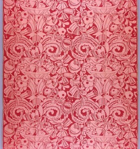 red textile with brocade pattern