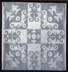 gray and white napkin with fish design