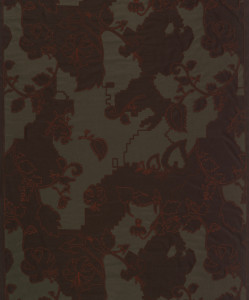 Dark green ground appliquéd with a dark brown layer. Large areas of the brown layer have been cut away and are stitched to the ground fabric in a stylized floral pattern using bright red thread.
