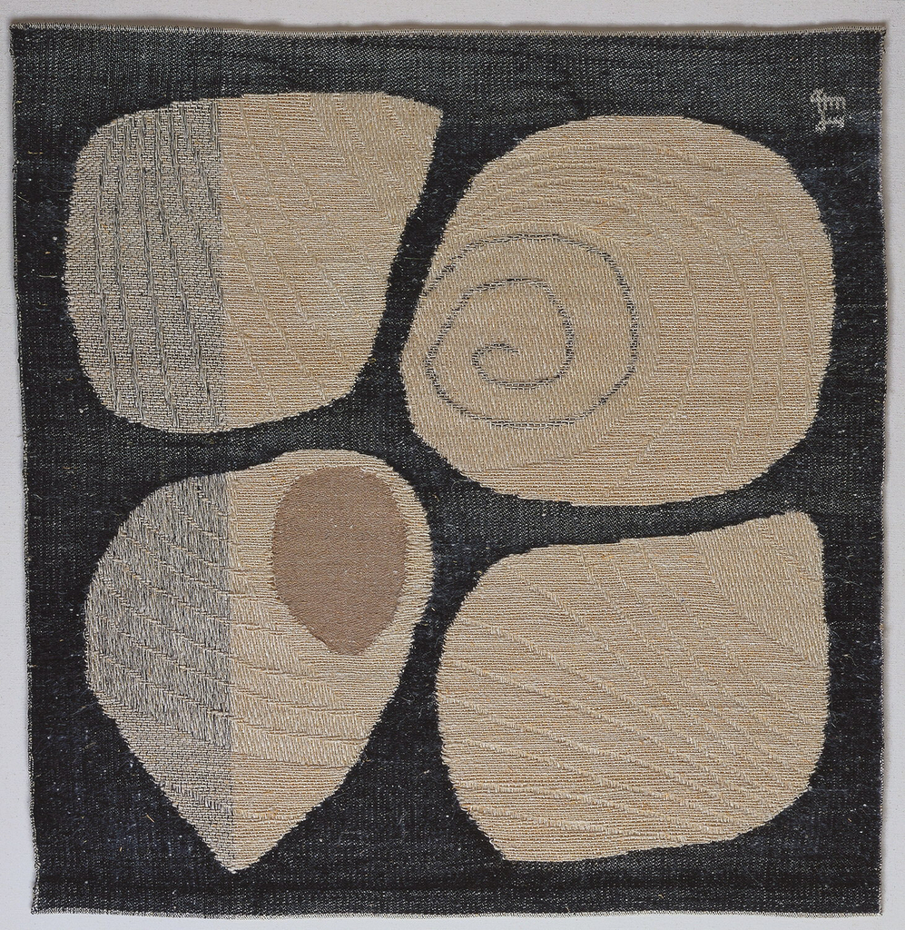 Four large, white curving shell shapes are inlaid in a dark grey weft satin ground by means of interlocking tapestry. Within the shell shapes, texture and patterning are created by contrasting twill and satin weaves.