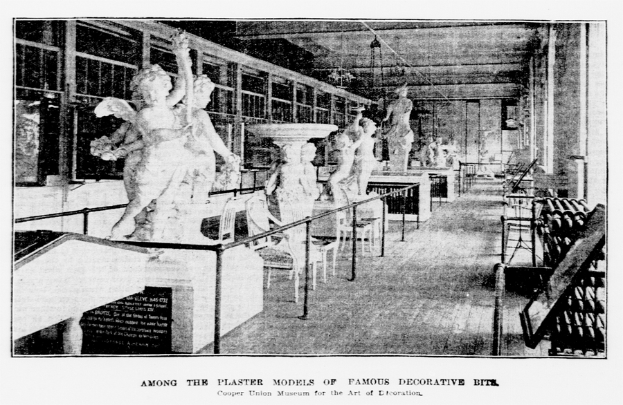 Newspaper clipping showing an image of cherubs and angel figures, larger than life size, holding birdbaths