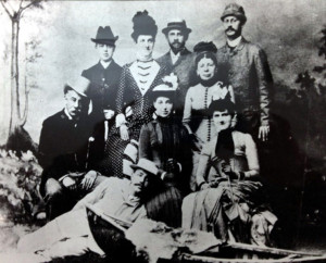 Nine people posed for a group portrait.