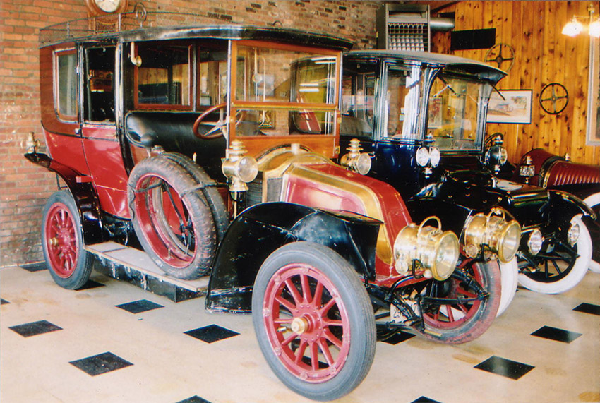 red, black and gold old-fashioned car