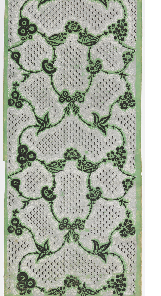 Vining floral pattern, printed in black, with background of leaves forming bullets, printed in gray, on green ground.