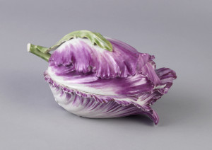 Tulip laid horizontally, with upper and lower portions of dish composed of full length petals.