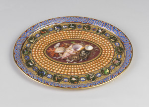 Oval tray with raised and everted rim. Decorated with outer border of interlaced triangular geometric motifs in lapis blue against brown background, surrounded by thin gold rims; then a border of tooled gilding with 16 roundels painted in polychrome of exotic birds, alternating with the smaller roundels with butterflies. Around central oval a wide band of trompe-l'oeil coffering. Center painted with arrangement of seashells, coral, and pearls against a faux marble background.