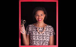 a young woman standing inside of a picture frame and holding a pair of scissors in the air
