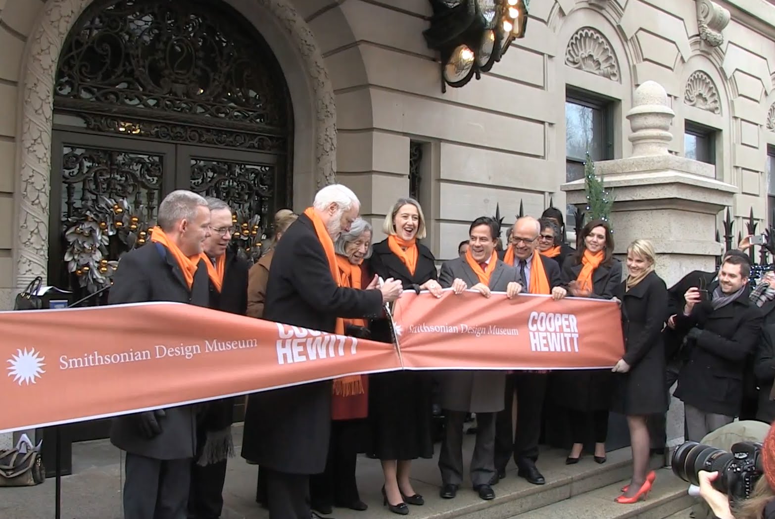 Officials cut an orange ribbon to open the museum on 121214