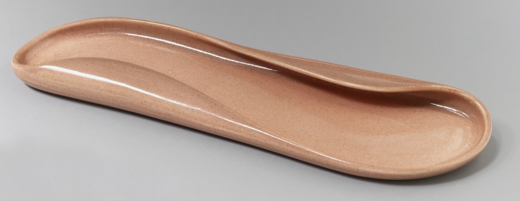 Pink oblong oval form with folded, undulating rim.