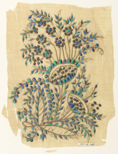 Image features muslin embroidered with a floral motif in gold threads and blue-green beetle wing "sequins." Please scroll down to read the blog post about this object.
