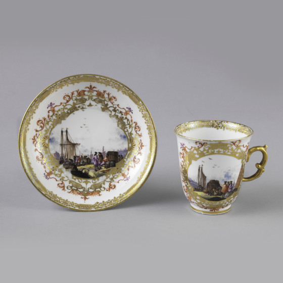 Chocolate Cup and Saucer with gold ornament and a landscape scene