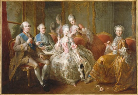 A family dressed in an opulent interior drinking hot chocolate