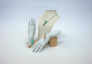 Neckace and bracelets are a wearable navigation system for people who are blind. Connected to a voice-controlled iPhone app and GPS, haptic vibrations not only guide the wearer, but are able to track obstacles above the knee.