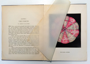 A book spread with text on the left and a color illustration of a white and pink wheel on the right