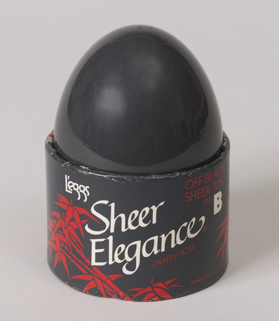 This is an egg-shaped product package It was designed by Roger Ferriter and produced by L'eggs Products, Inc. and made for (as the client) Hanes Corp. and firm: Lubalin Smith Carnase. It is dated 1970s. Its medium is plastic, paper.