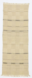 Long vertical textile featuring a checkered pattern in two barely distinguishable shades of light tan interspersed with horizontal black lines of varying thicknesses.