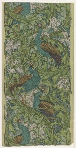 Arabesque of large acanthus rinceaux, tulips, and wiry scrolls, with large perching peacocks whose tails hang downward.