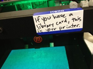 sticker that reads "If you have a library card, this is your printer."