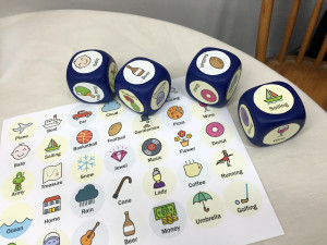 dice with familiar images and words on each face.
