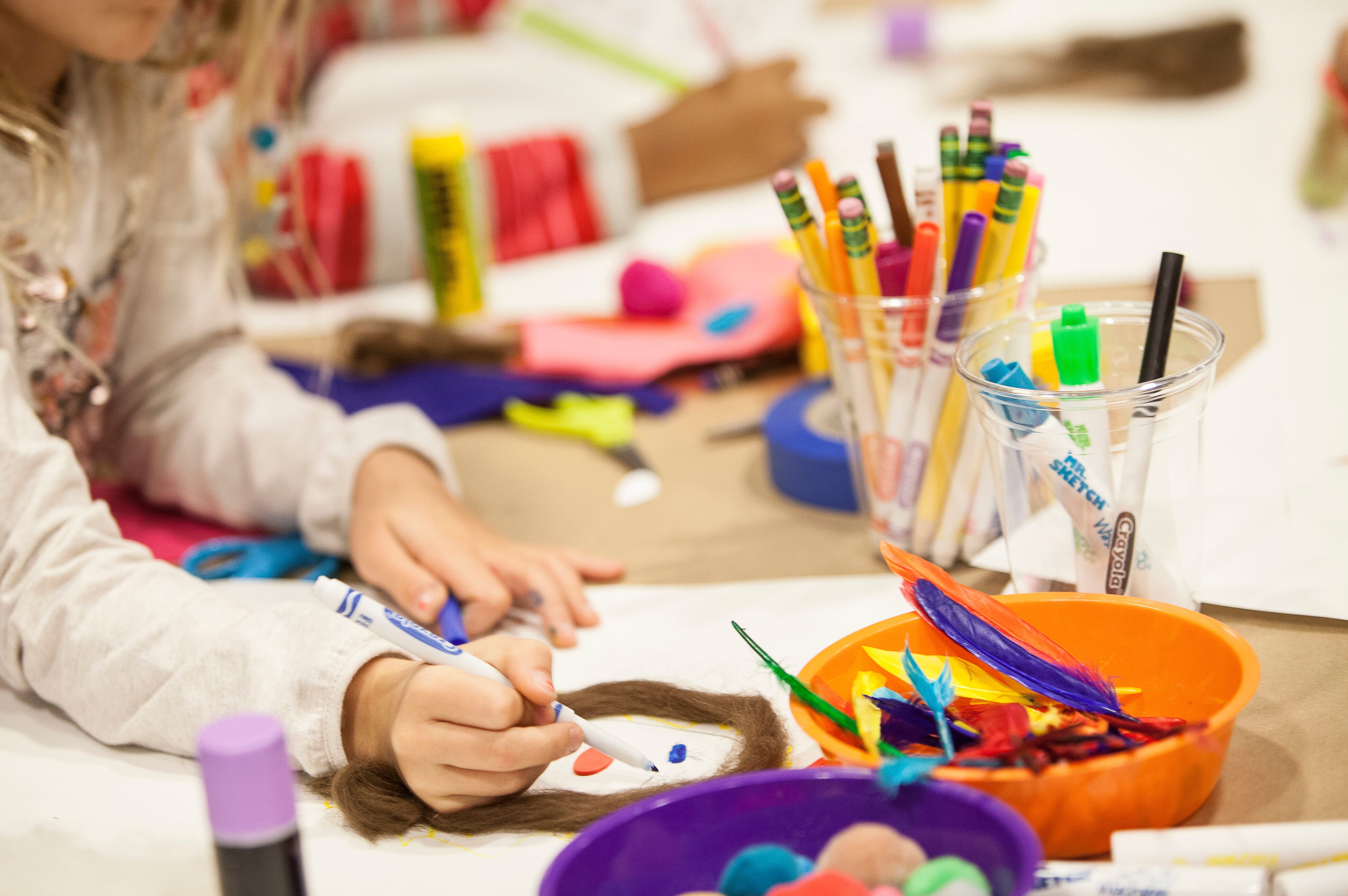 A child enjoys a hands-on design activity at Cooper Hewitt.