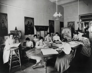 Image of a Class of the Womans Art School studying the museum's collection,