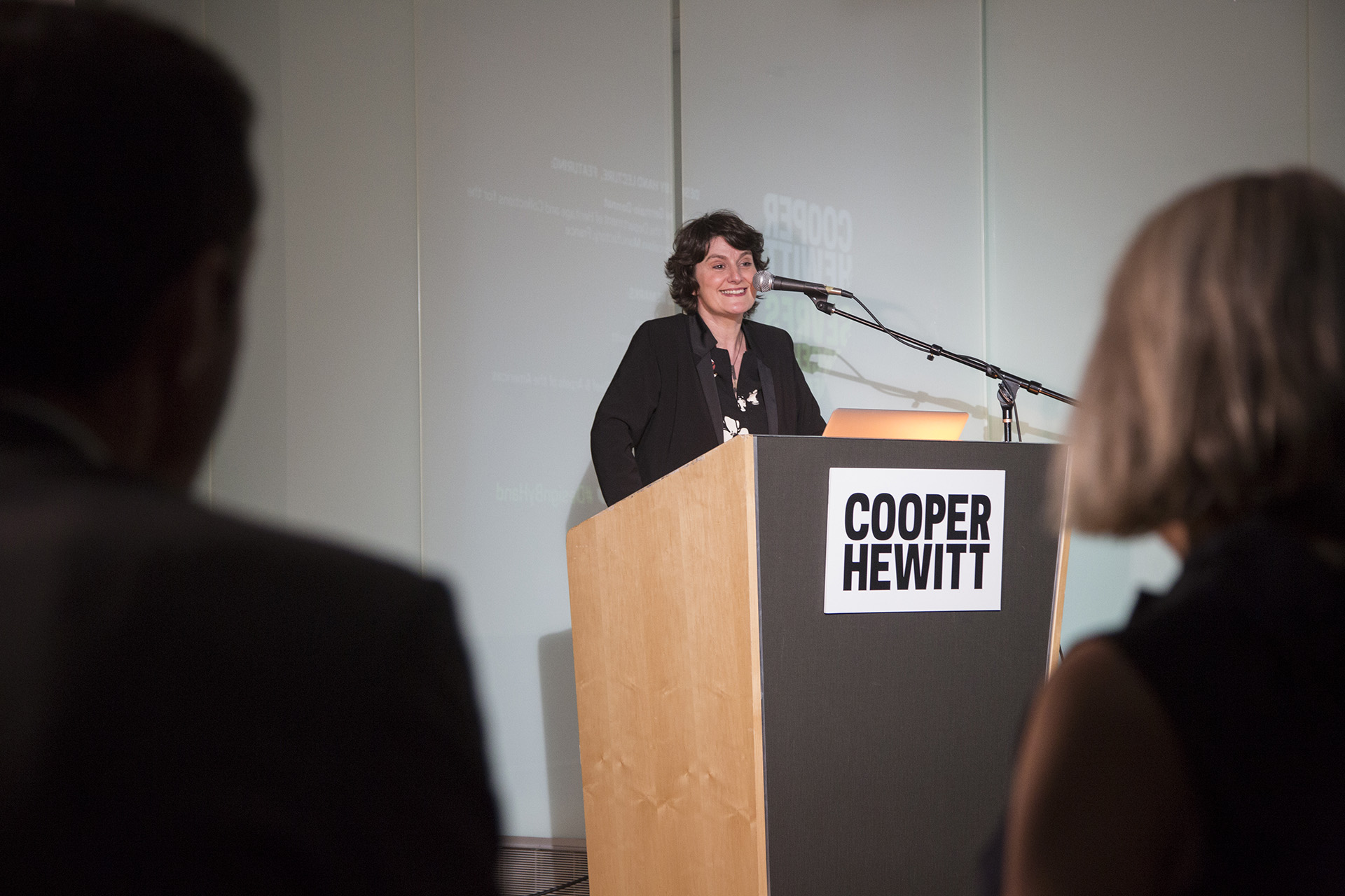 Image of Christine Germain-Donnat at Cooper Hewitt podium, giving a lecture about Sèvres Porcelain