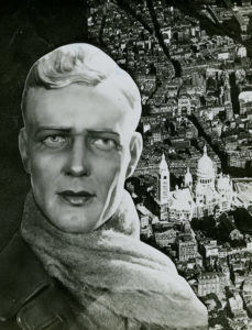 Photograph of store window display. Paris, France. n.d. Headshot of Charles Lindbergh in wax by Siégel in a scarf and leather jacket positioned atop an aerial view of Paris. Thérèse Bonney (1897-1978). Cooper-Hewitt Rare Books. 2000-42-1.