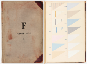 Oversized sample book with two columns of fabric swatches in triangular wedge shapes. Samples have numbers stamped next to them in dark blue ink. Samples are mainly woven stripes, plaids and solids in white or pale to medium shades. Some have simple figured, striped or geometric grounds. Many swatches are stamped "OUT" in dark ink.