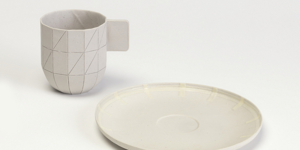 Design by Hand Workshop on Material and Prototype with Scholten & Baijings. Image of a white cup and plate on white table. Scroll down for date, time, and registration information.