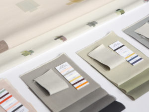 Design by Hand Color Workshop. Image of fabric swatches orderly on a white table. Scroll down for information on the program's date, time, and registration.