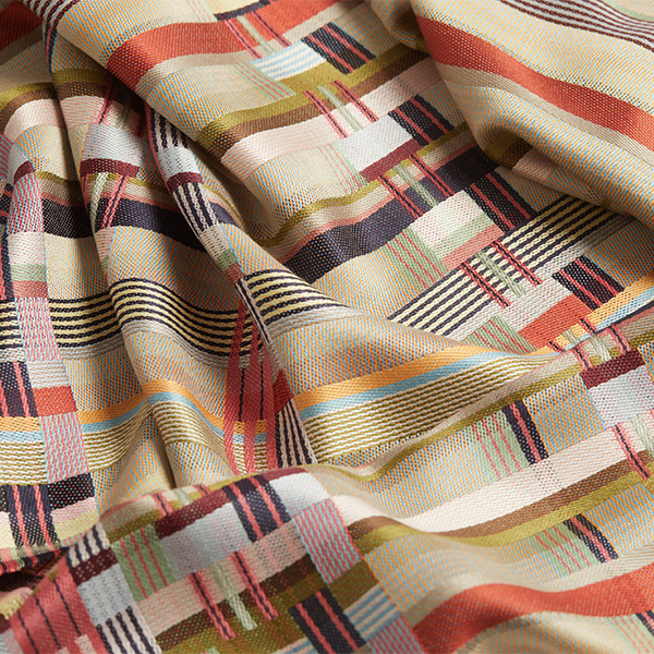 Close view of fabric of a colorful plaid scarf